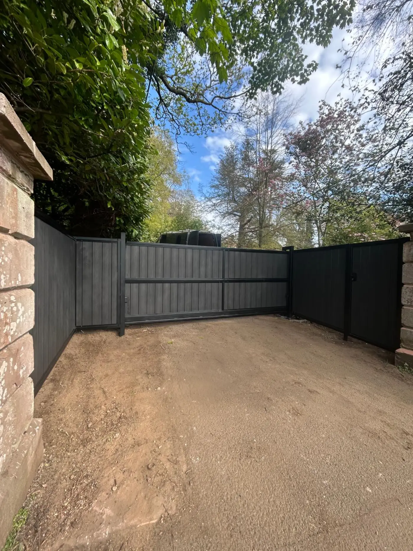 Inside view of completed cantilever sliding gate with matching fencing at Coupar Angus