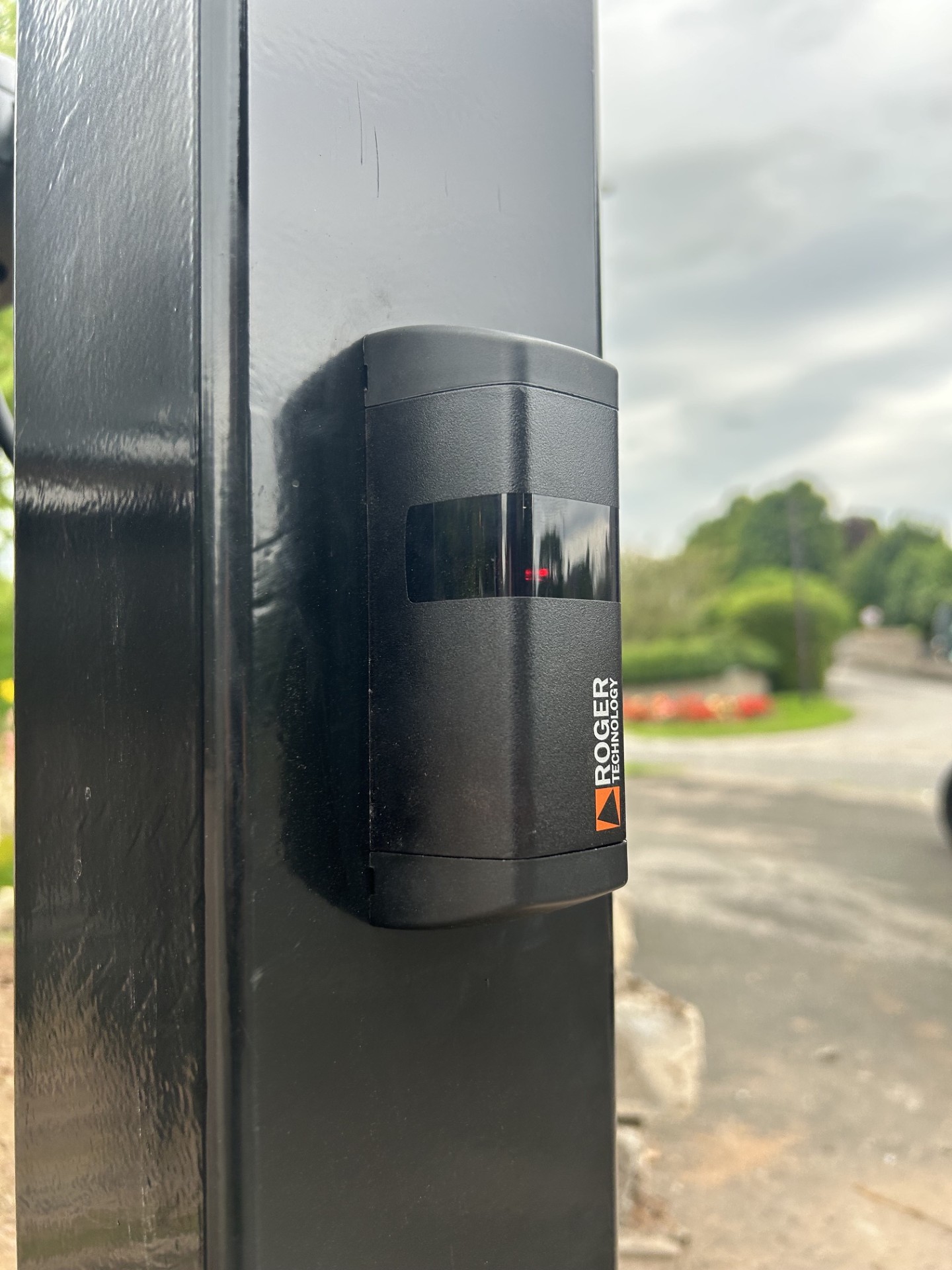 Roger Technology safety photocell mounted on a gate post by KLR Design Limited