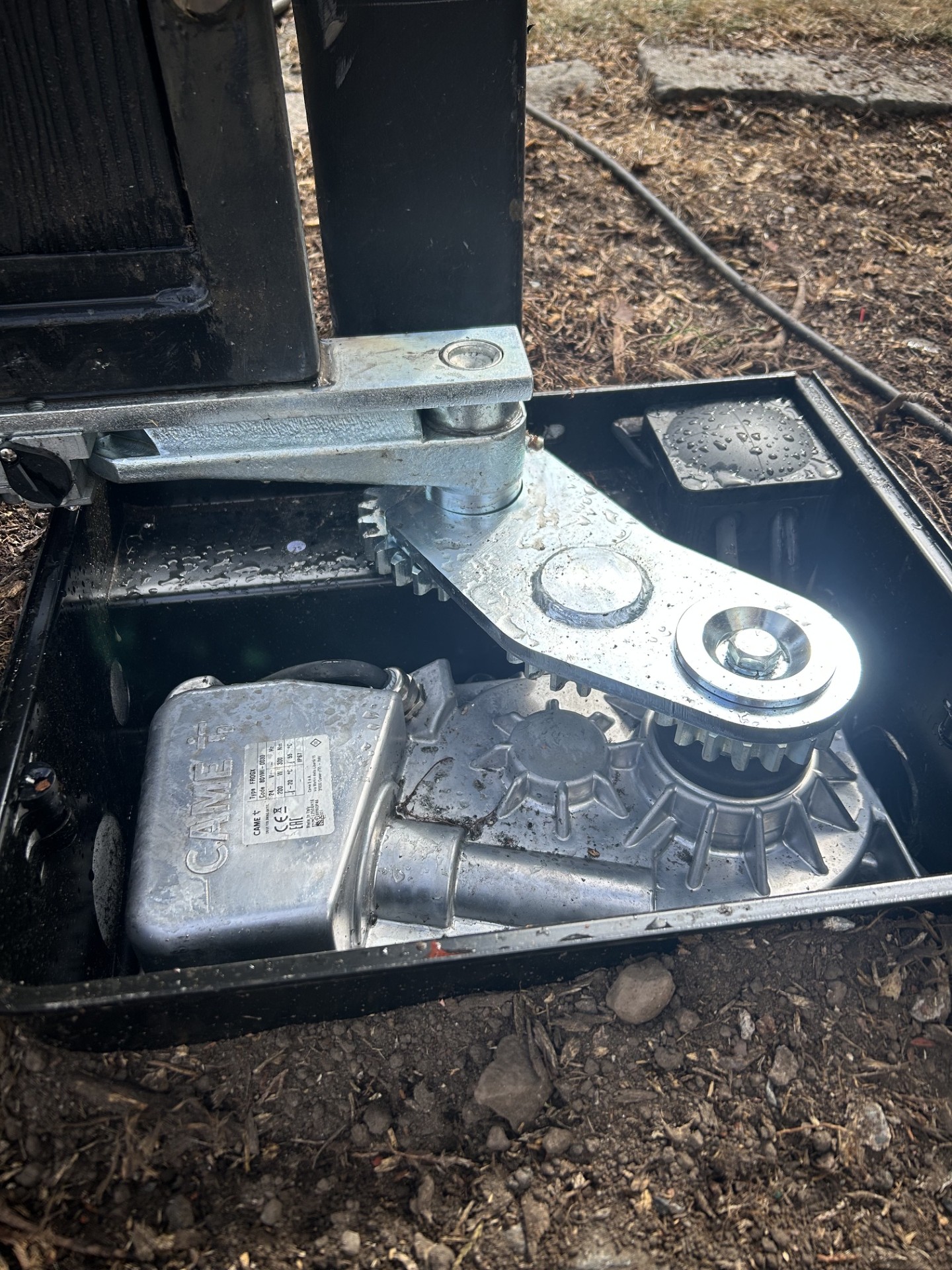 CAME Frog underground gate motor installed in a foundation box by KLR Design Limited