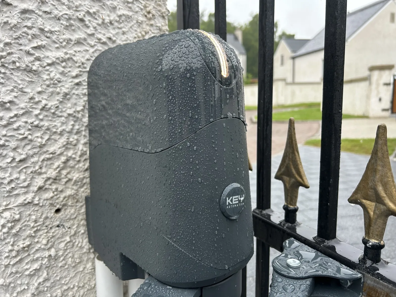 KEY Automation swing gate motor close-up Close-up of a KEY Automation swing gate motor installed on wrought iron gates by KLR Design Limited