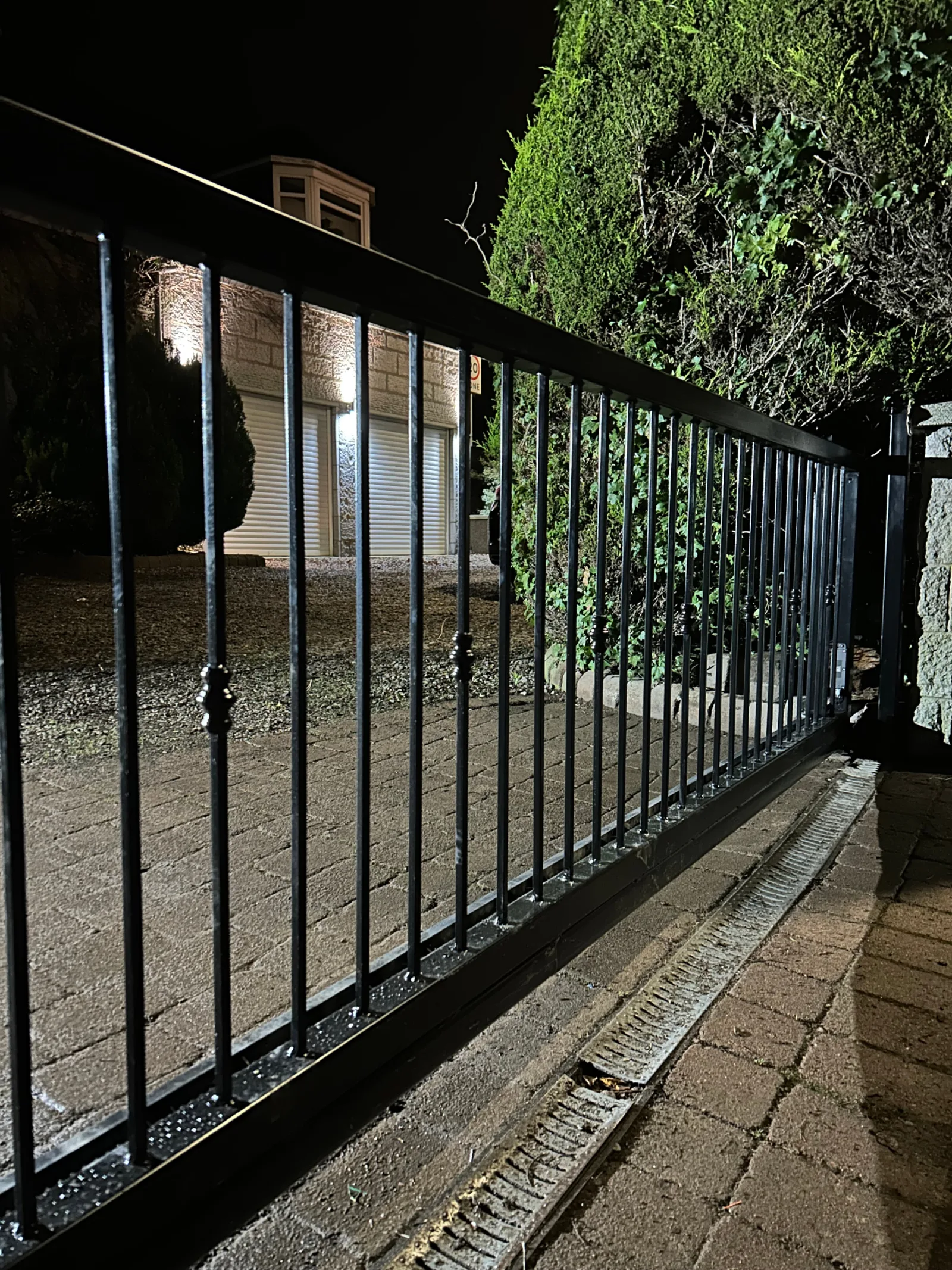 Aberdeen Wrought Iron Cantilever Sliding Gate (Night) - Cantilever sliding gate by KLR Design in Aberdeen