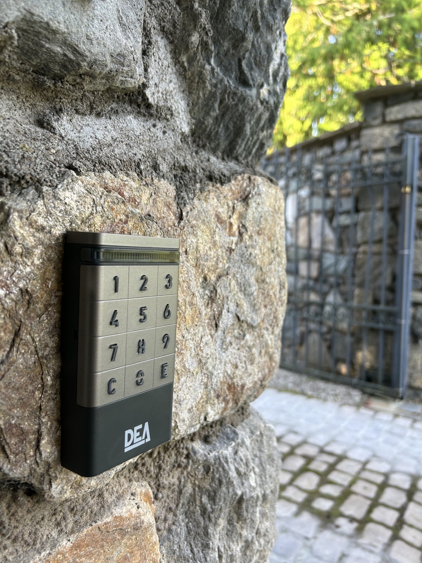 DEA keypad access control mounted on a stone pillar by KLR Design Limited