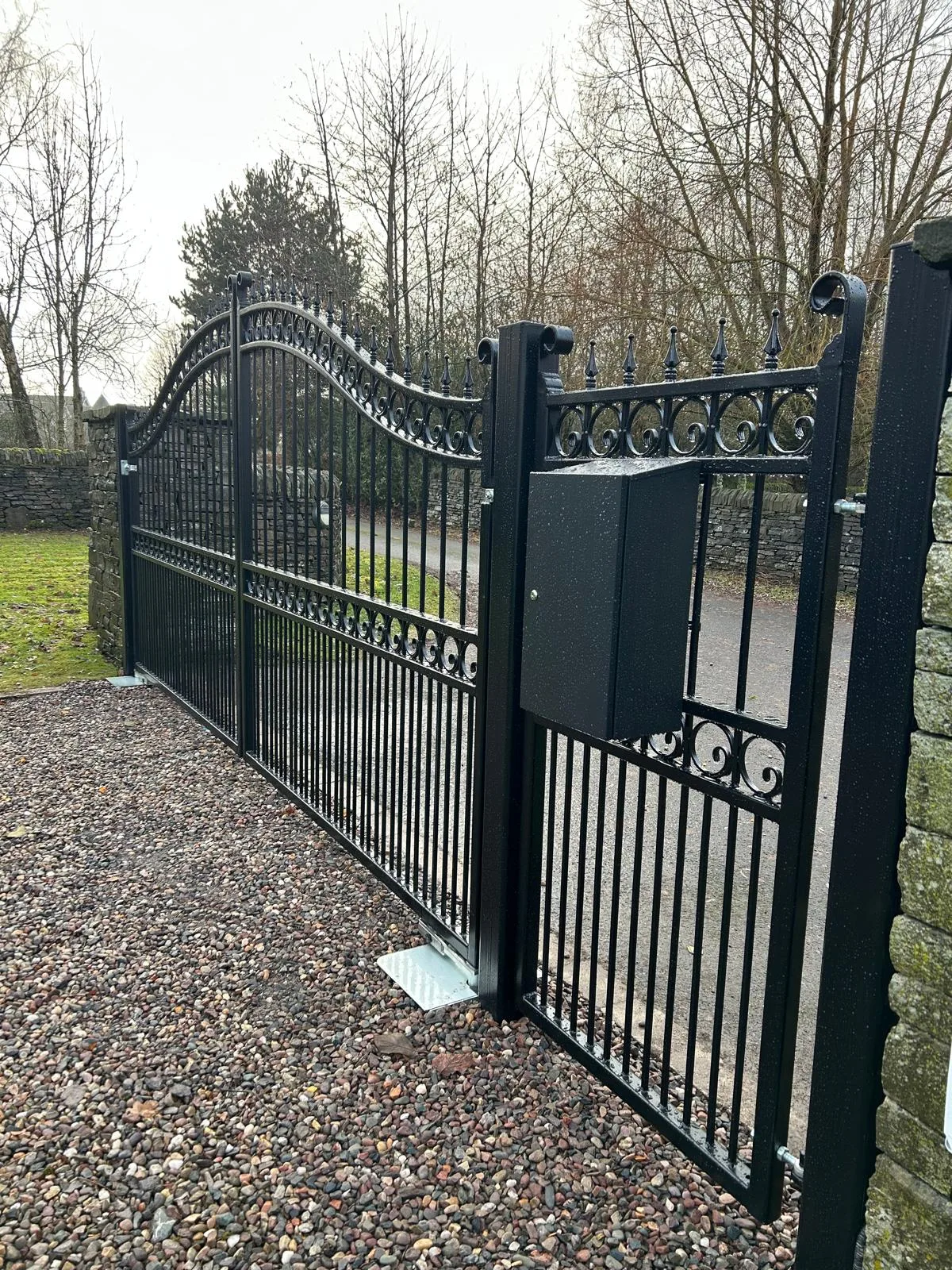 Automated wrought iron swing gates with underground motor and Videx intercom access control installed in Scotland by KLR Design Limited