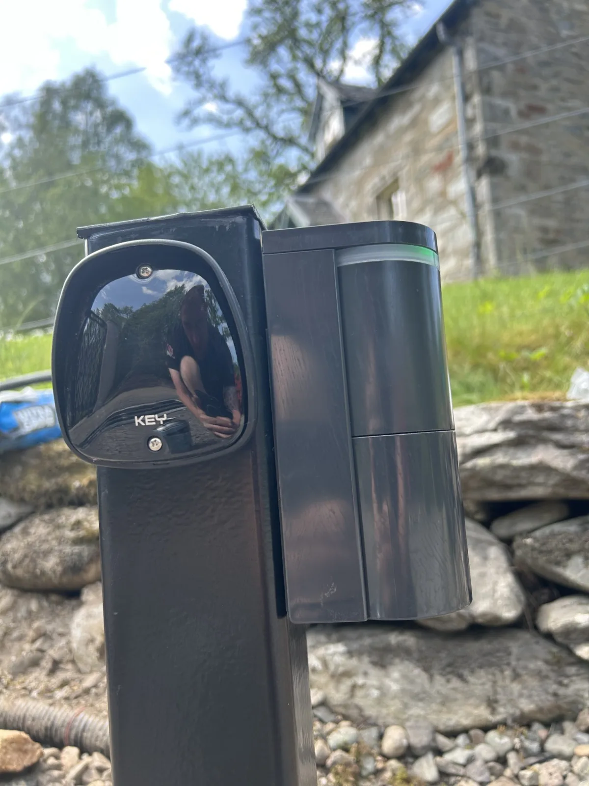 Optex vehicle detector installed beside a KEY safety photocell on a gate post by KLR Design Limited, Scotland