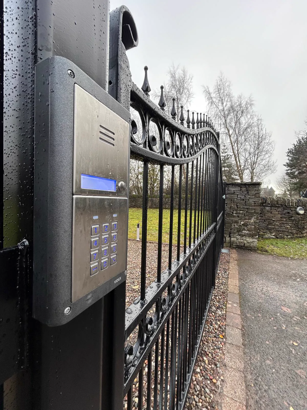 Wrought iron automated gate with Videx hardwired intercom and keypad by KLR Design Limited