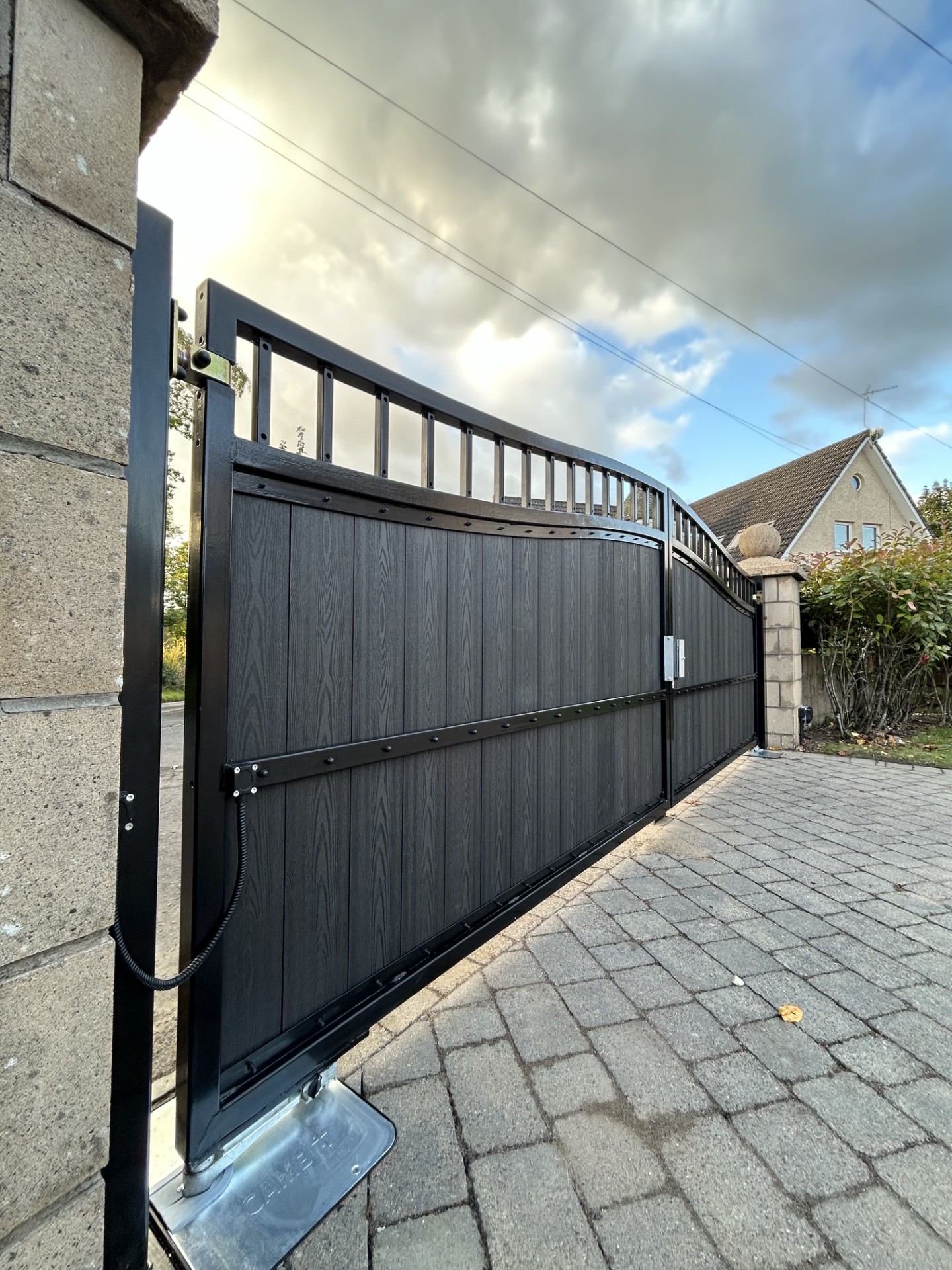 Black composite automated swing gate with CAME underground automation installed by KLR Design Limited in Scotland