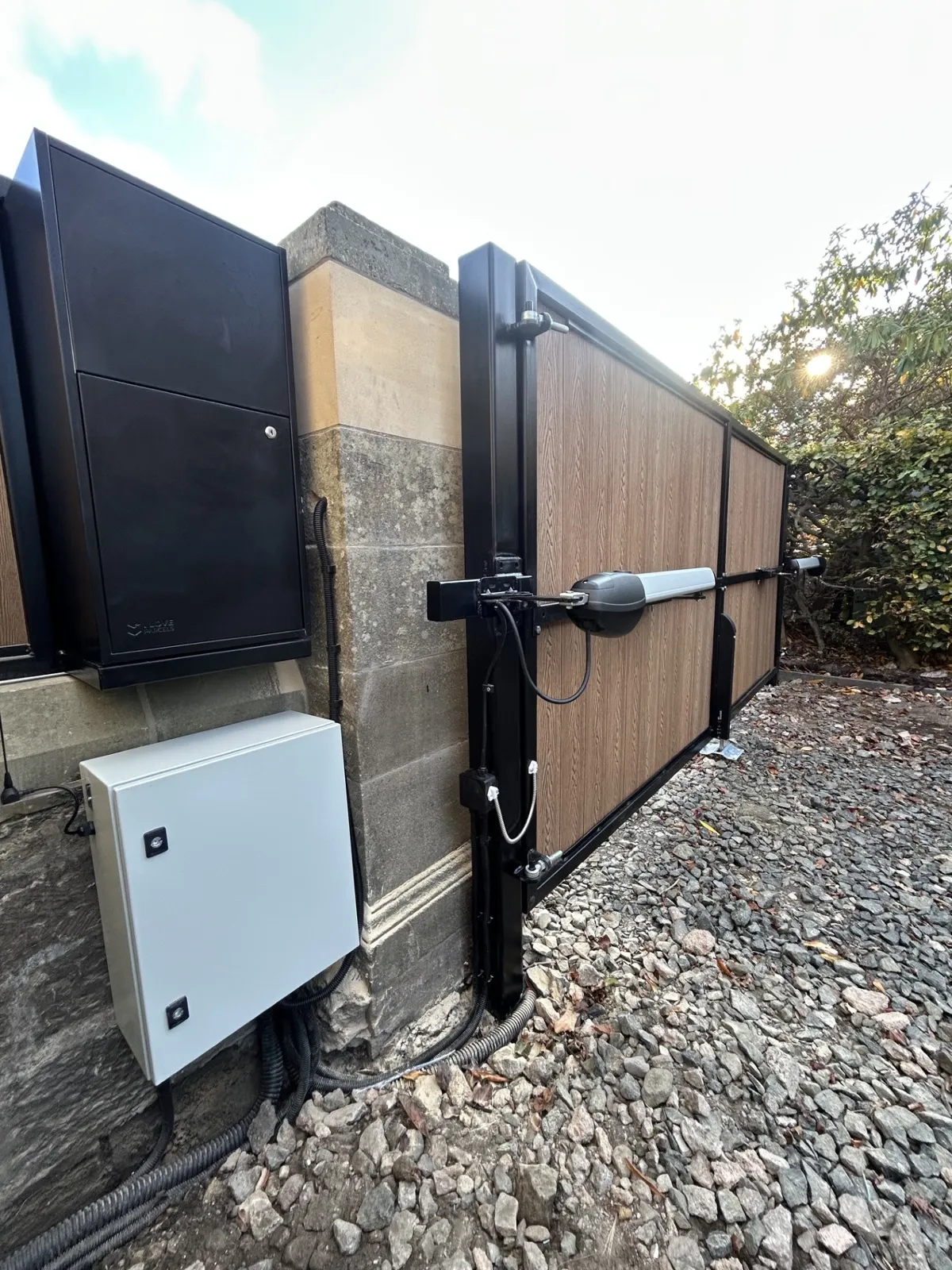 Roger Technology above-ground arm motor on a composite sliding gate installed by KLR Design Limited