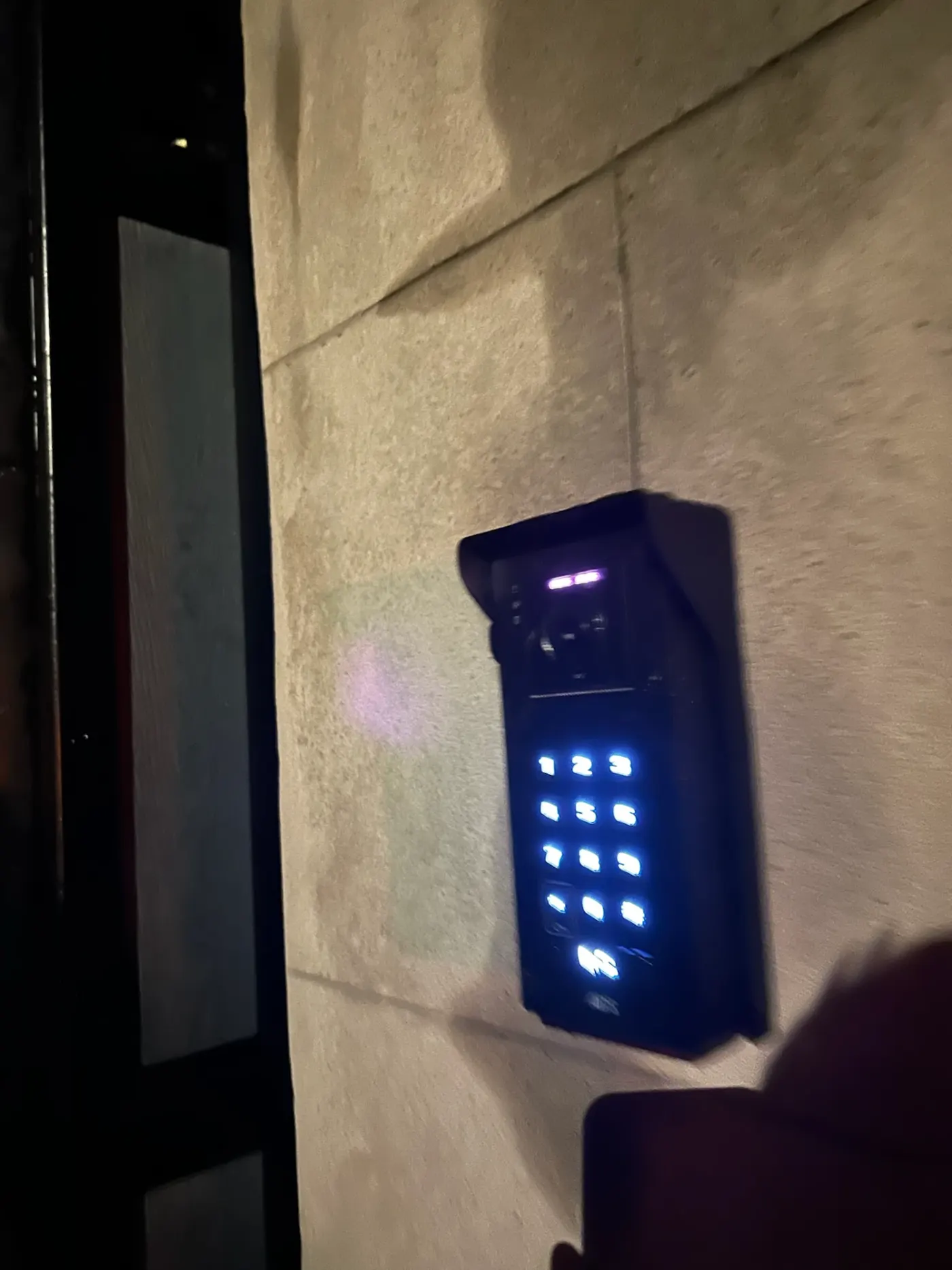 AES Global Ltd illuminated intercom keypad at night installed by KLR Design Limited
