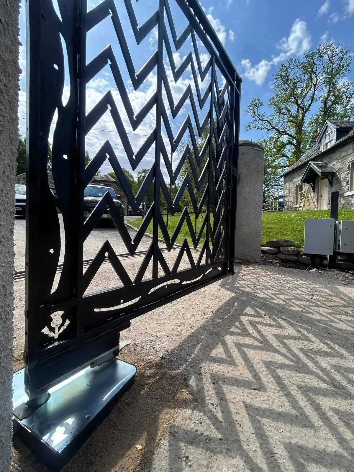 Bespoke chevron-pattern laser-cut entrance gate at Edinample Castle, Lochearnhead — KLR Design Limited
