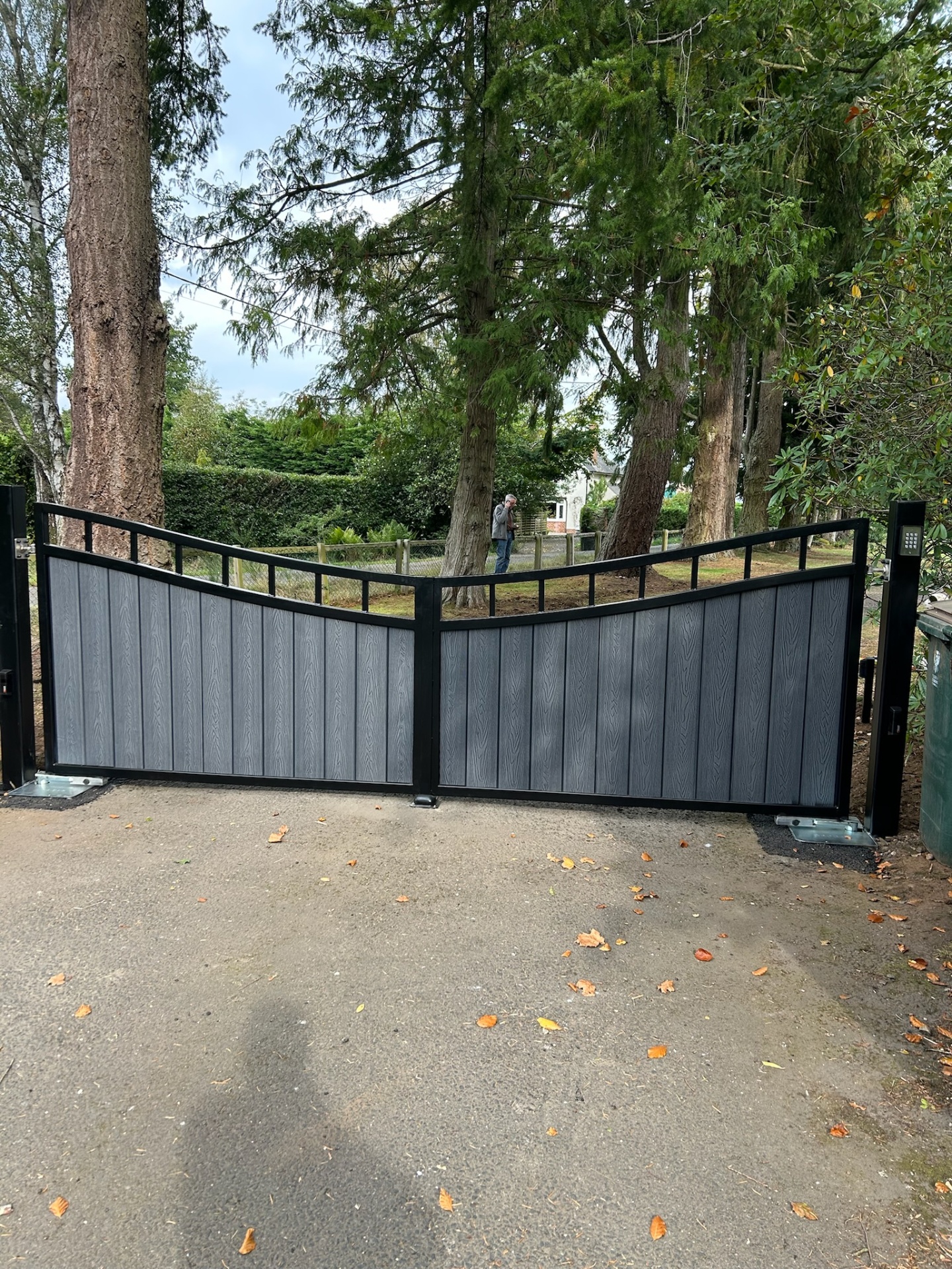 Composite swing gates with chevron top design and keypad — installed by KLR Design Limited