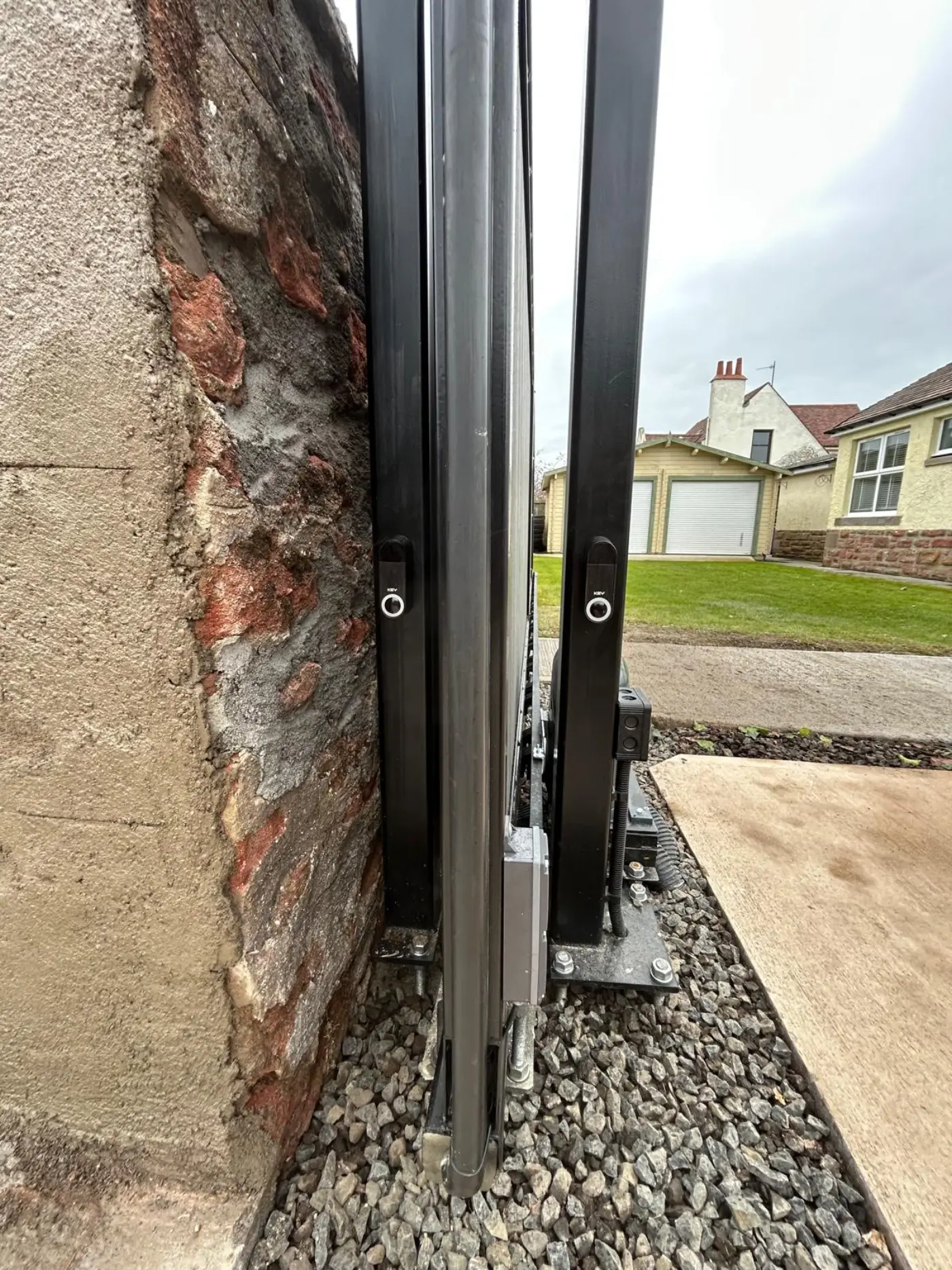 Close-up of KEY automation motor installed on cantilever sliding gate in Angus