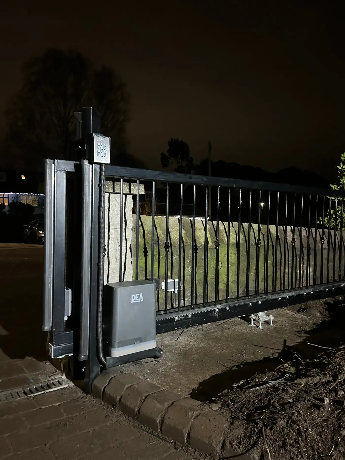 Wrought iron sliding gate with DEA motor and keypad access — KLR Design Aberdeen installation