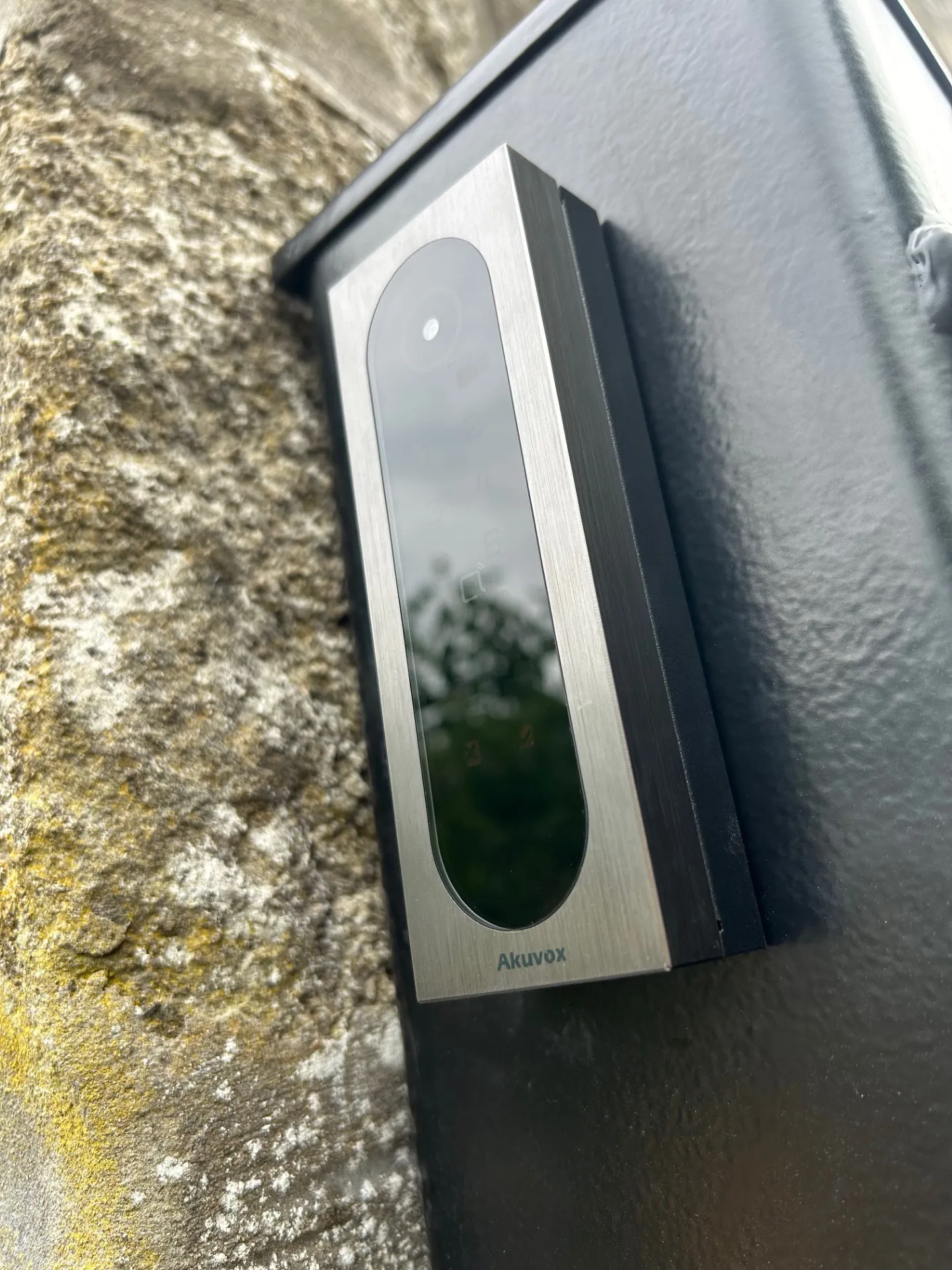 Akuvox intercom stainless steel unit installed on stone wall