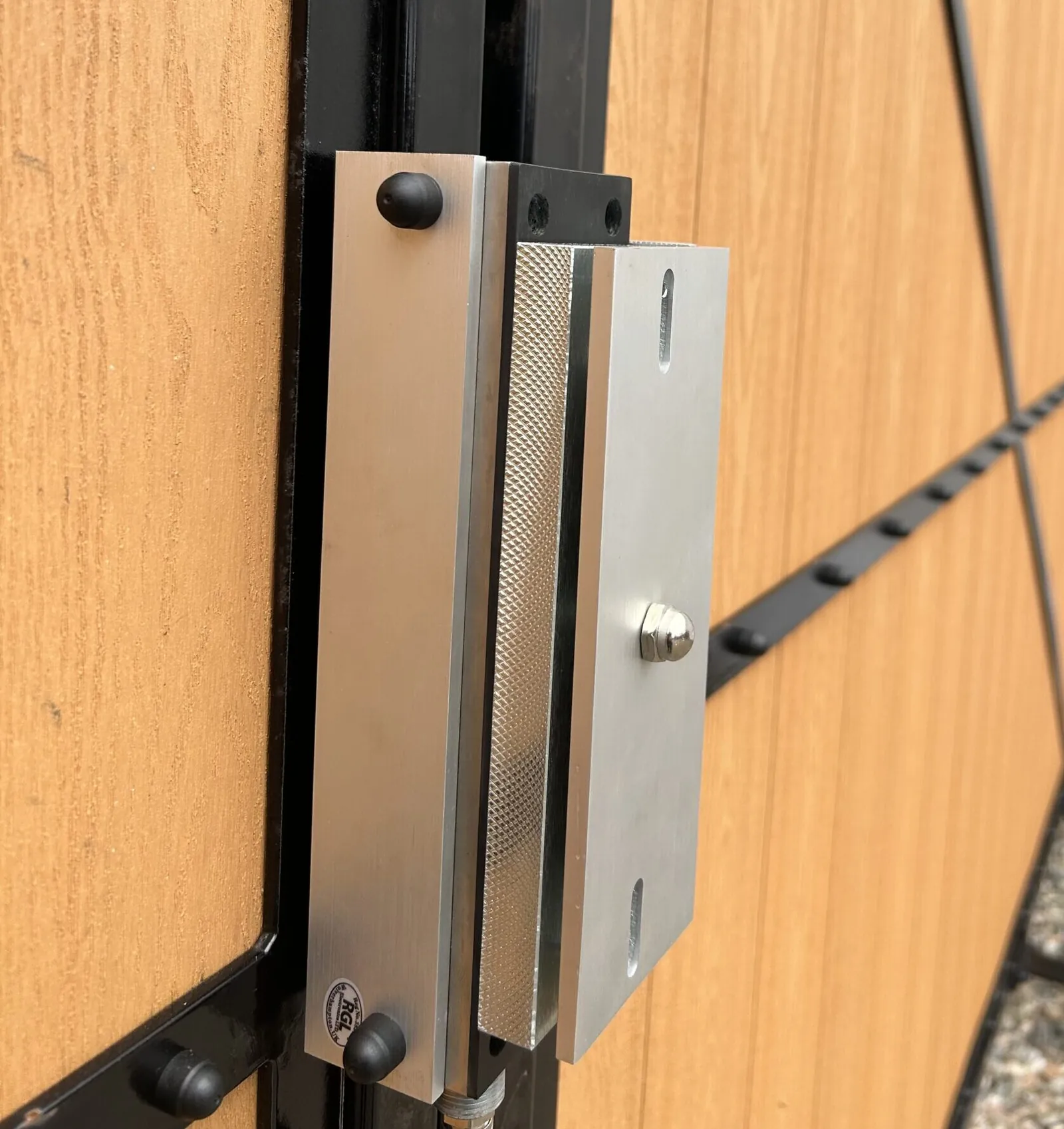 Access control locking hardware installed on composite electric gates by KLR Design Limited