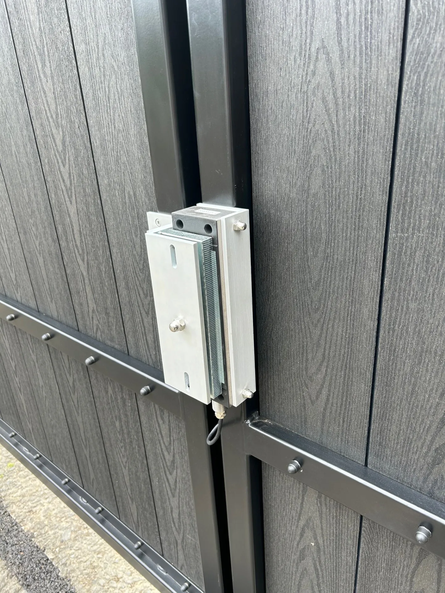 Electric gate locking hardware fitted to a commercial access control system by KLR Design Limited