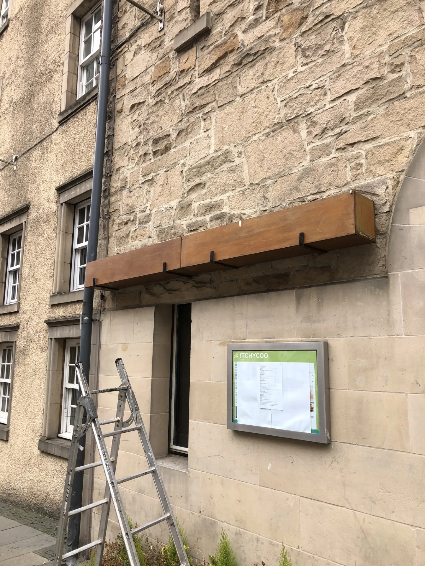 Commercial entrance canopy installation in progress on the Royal Mile, Edinburgh