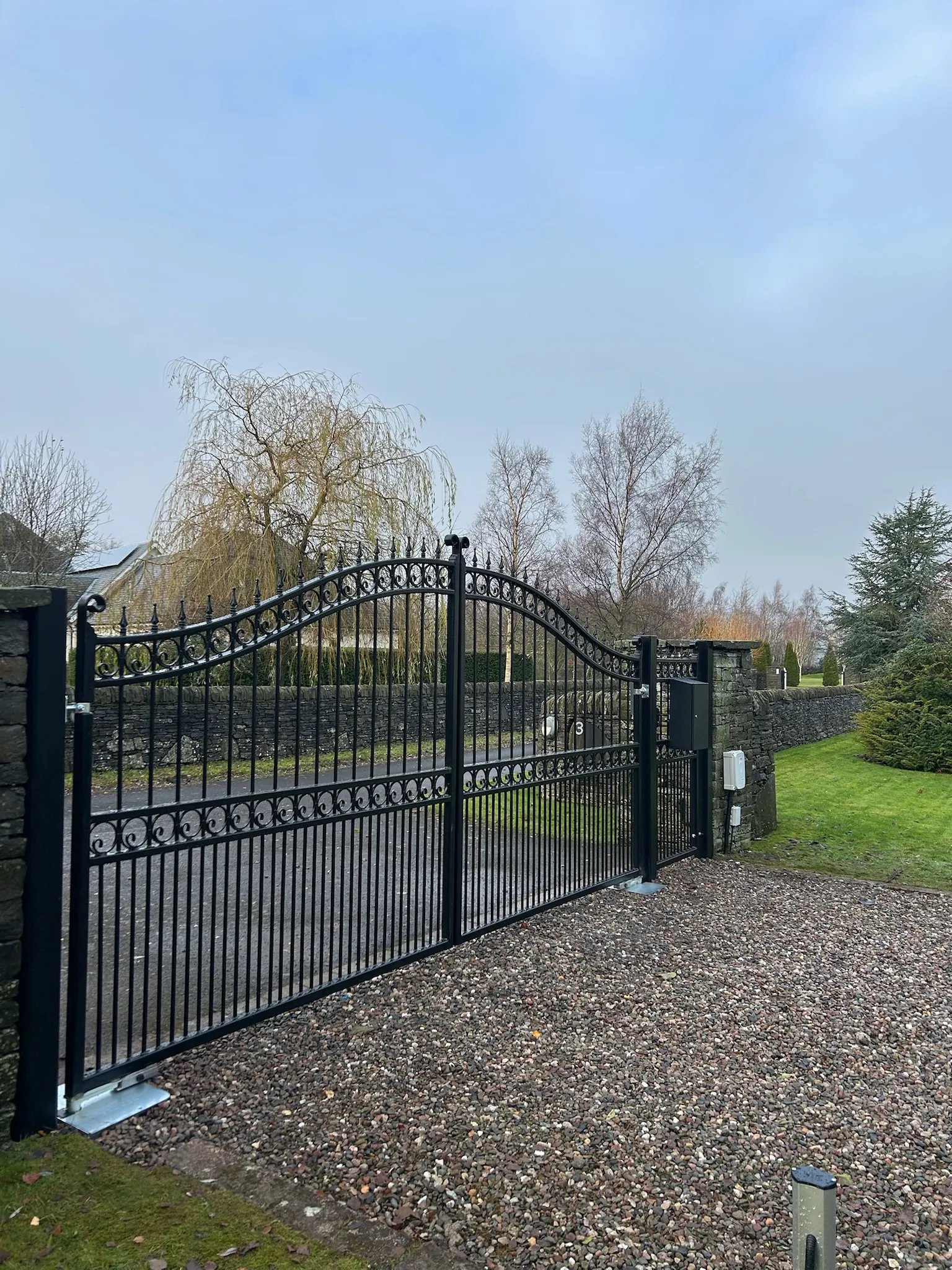 Hand-fabricated wrought iron gates with matching railings installed in the Scottish borders by KLR Design Limited
